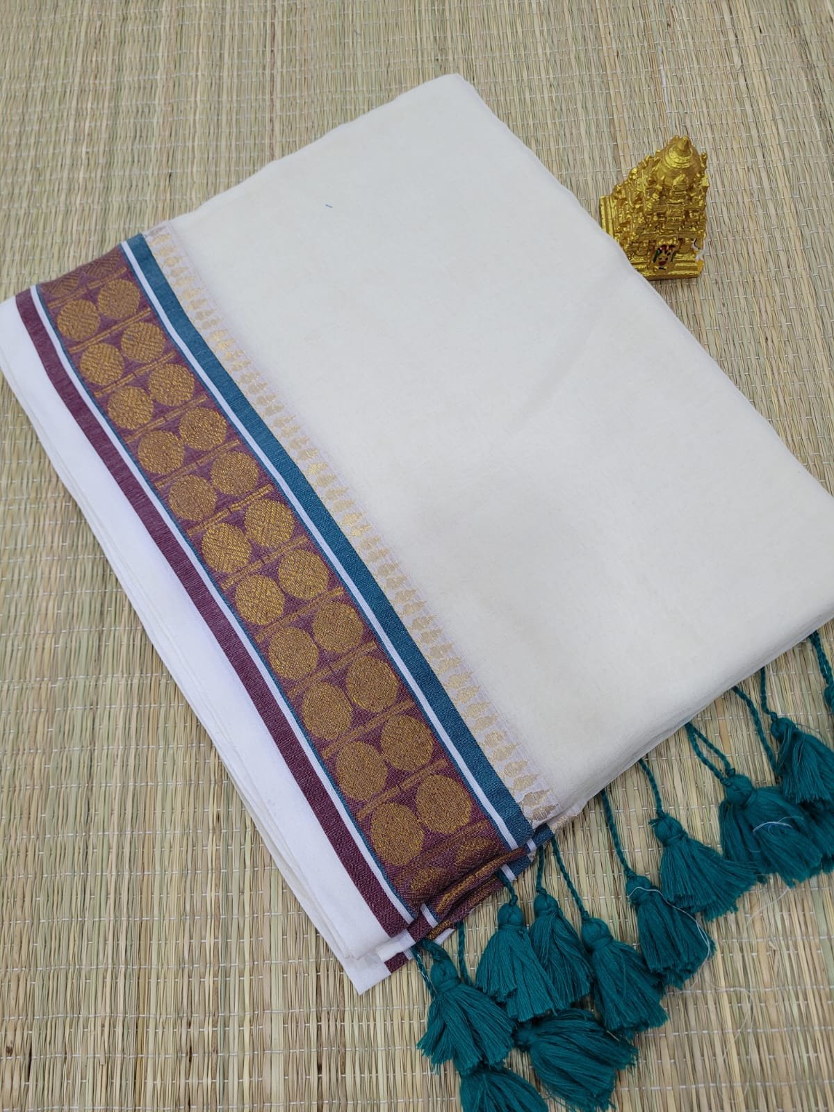 Sophisticated Elegance: Cream Mul Cotton Saree with Peacock Green, Coffee Brown & Traditional Rudraksha Borders