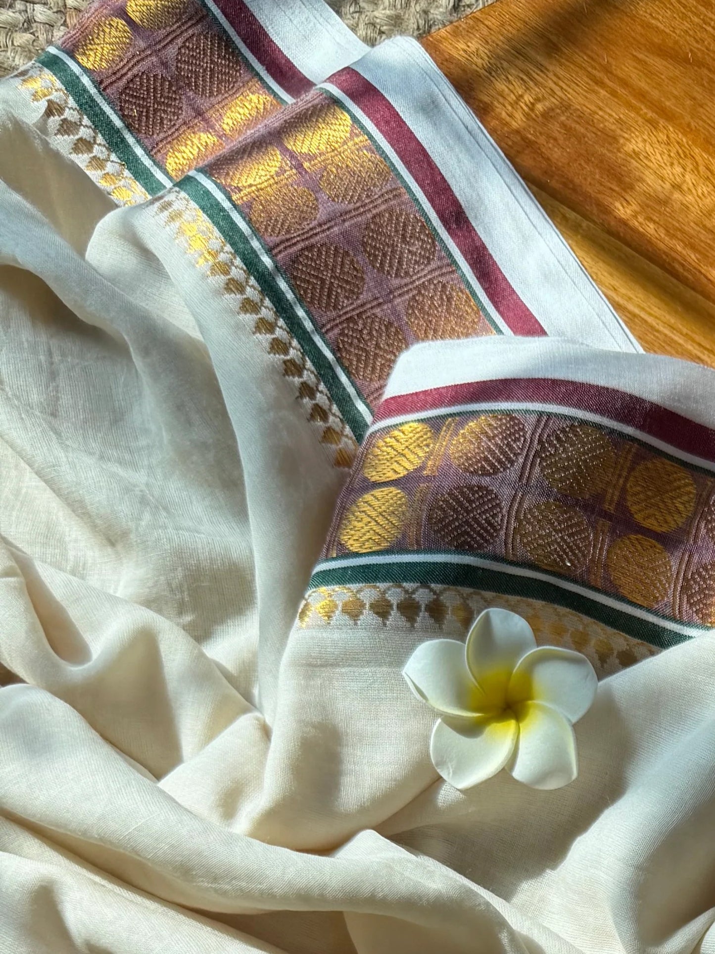 Sophisticated Elegance: Cream Mul Cotton Saree with Peacock Green, Coffee Brown & Traditional Rudraksha Borders